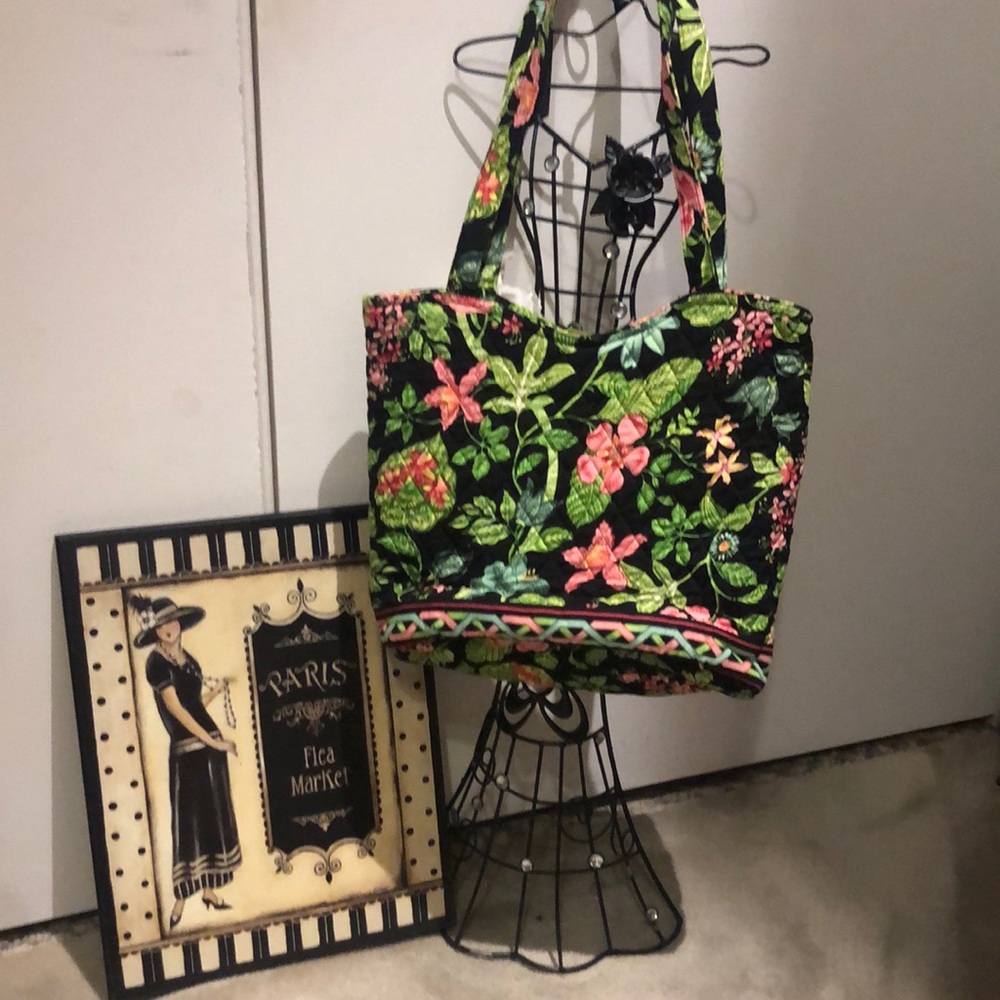 Vera Bradley  tote bag has many zipper compartment/pouches.
approximately 12 “.